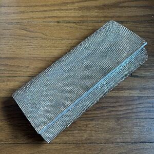 Rose gold sequined clutch